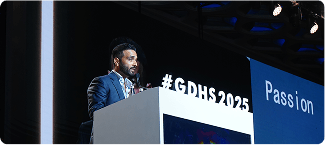 Speaker at podium with GDHS branding
